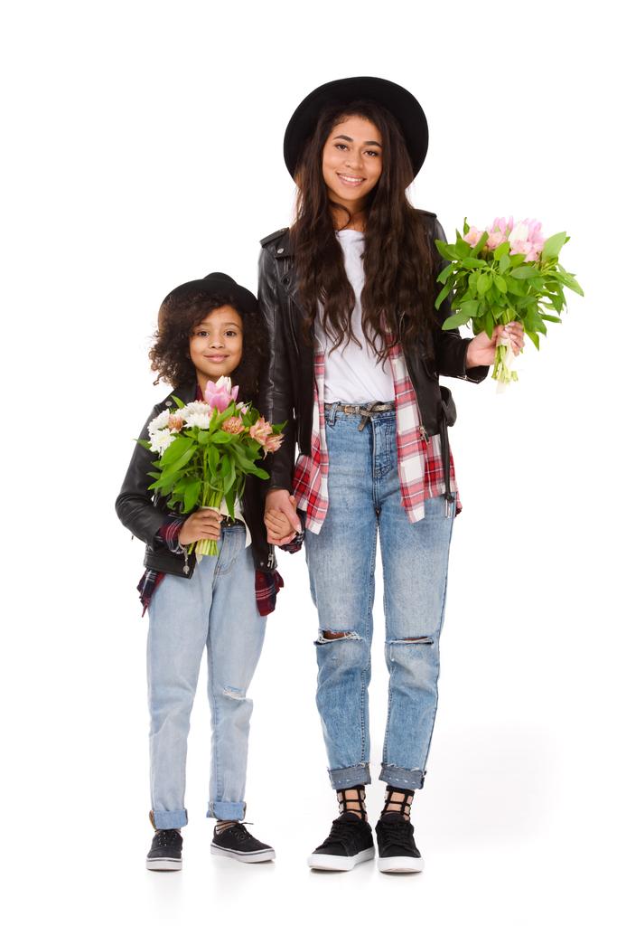young mother and daughter with beautiful bouquets isolated on white - Photo, Image