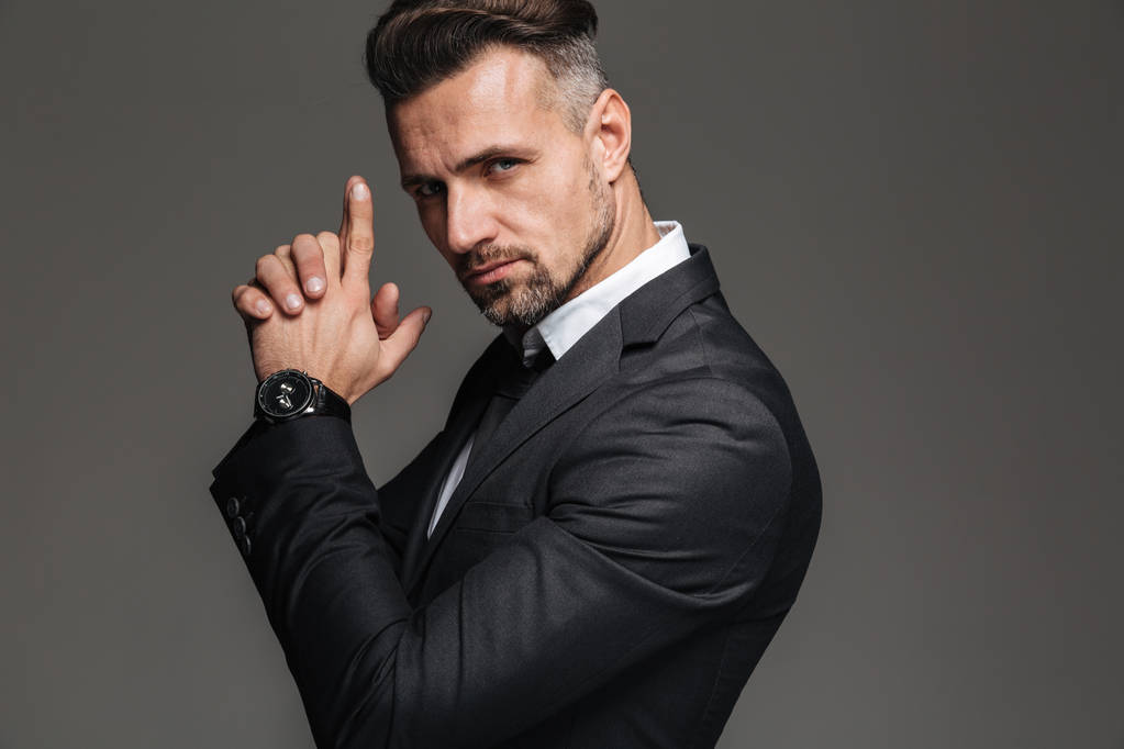 Photo in profile of elegant adult man 30s in black suit looking  - Photo, Image