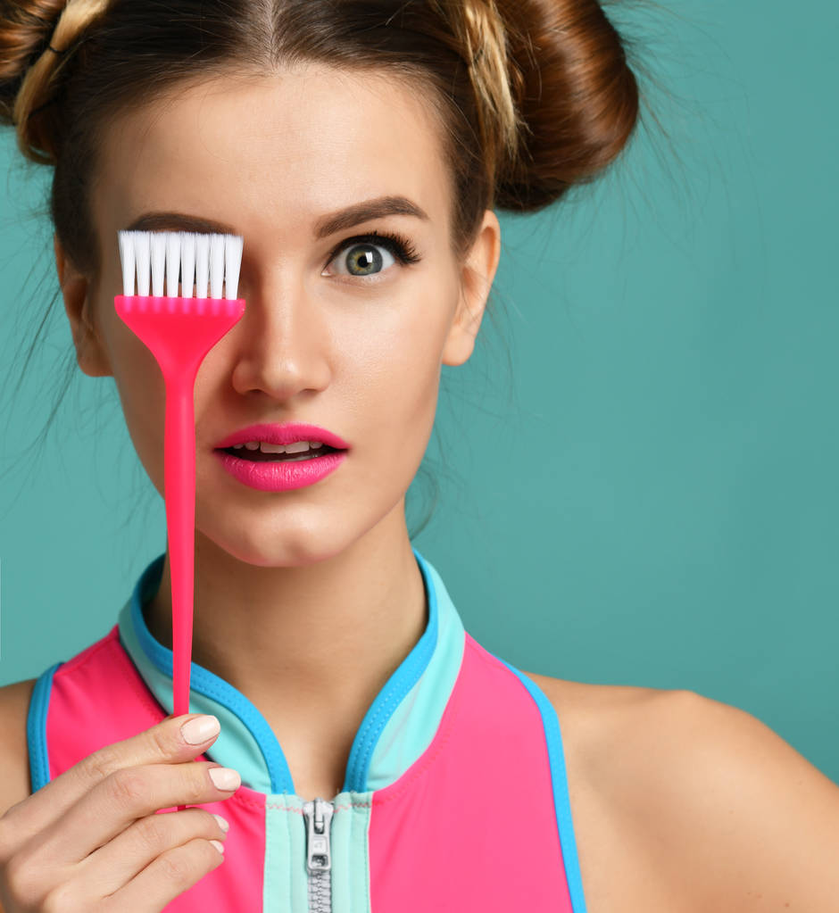 brunette woman with colorful pink basic applicator hair tint brush  - Photo, Image