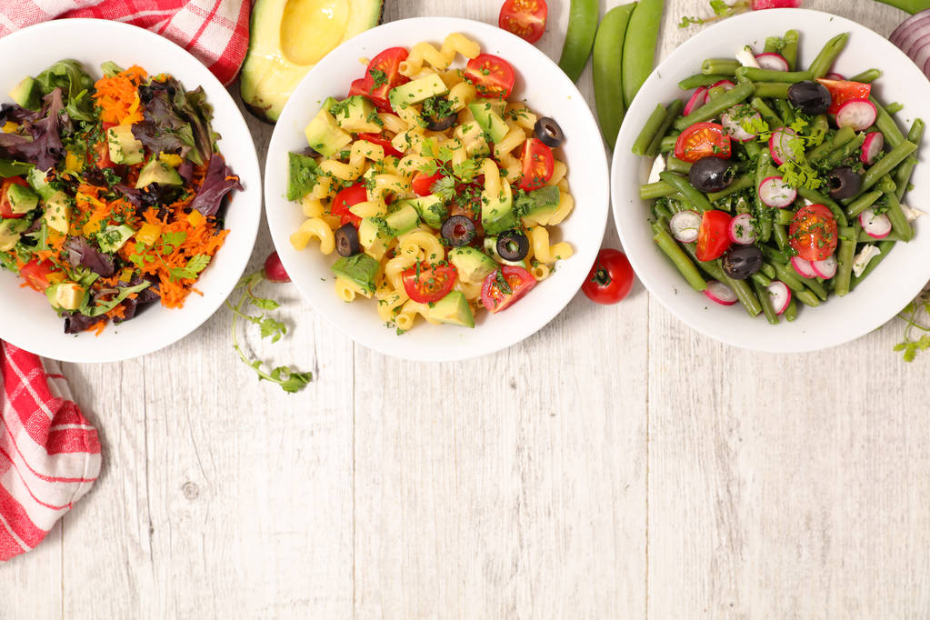 Top view of assorted vegetable salad bowls. - Photo, Image