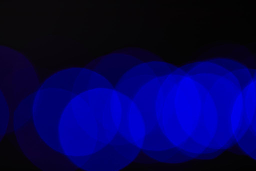 抽象的な暗いブルーぼやけた円 - 写真・画像