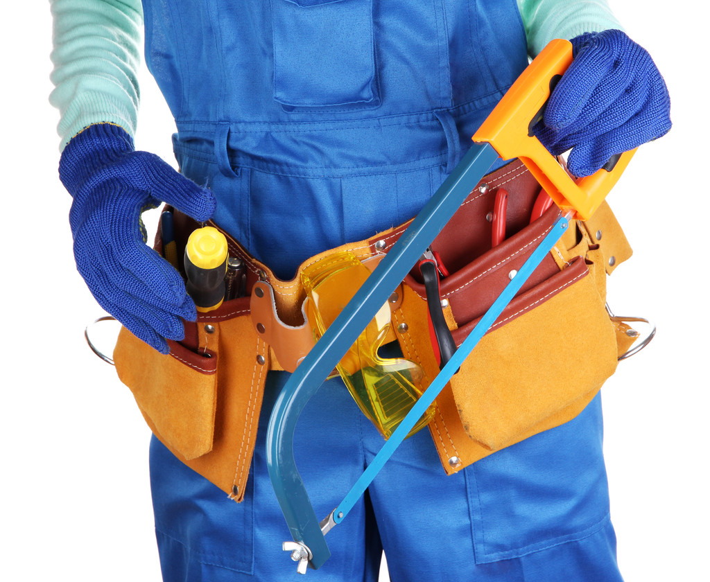 Male builder in blue overalls with saw isolated on white - Photo, Image