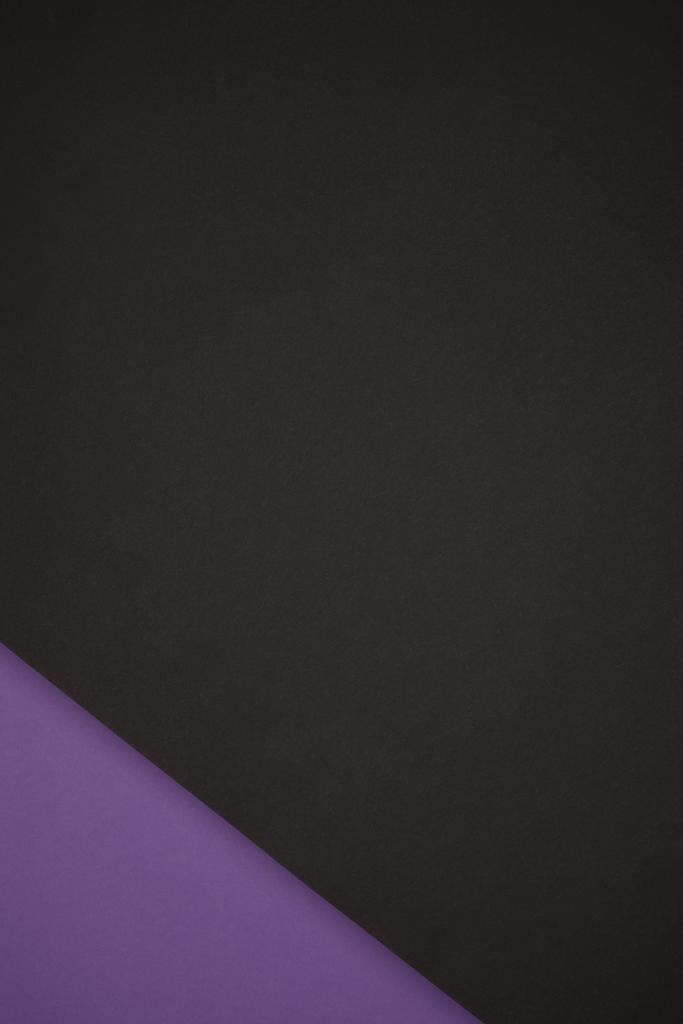 dark abstract background made from black and purple colored paper - Photo, Image