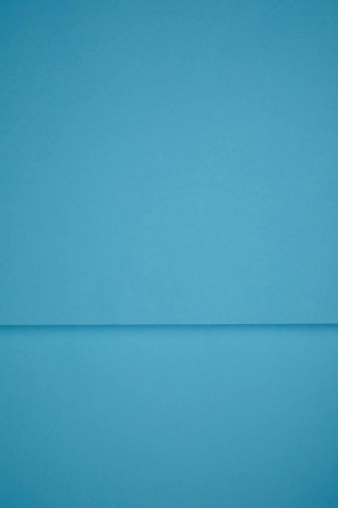 bright blue abstract background from colored paper  - Photo, Image
