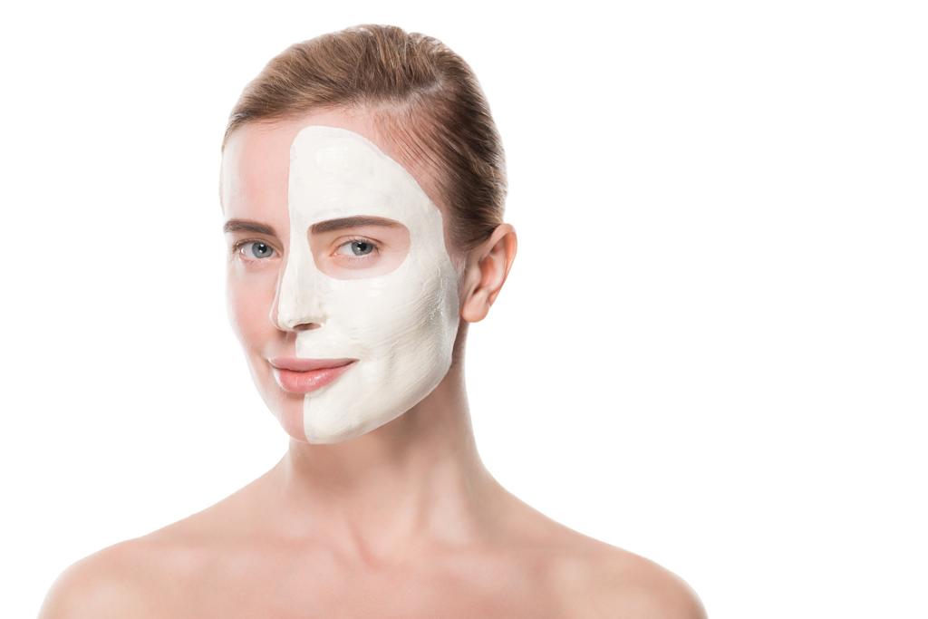 Woman with facial skincare mask on half face isolated on white - Photo, Image