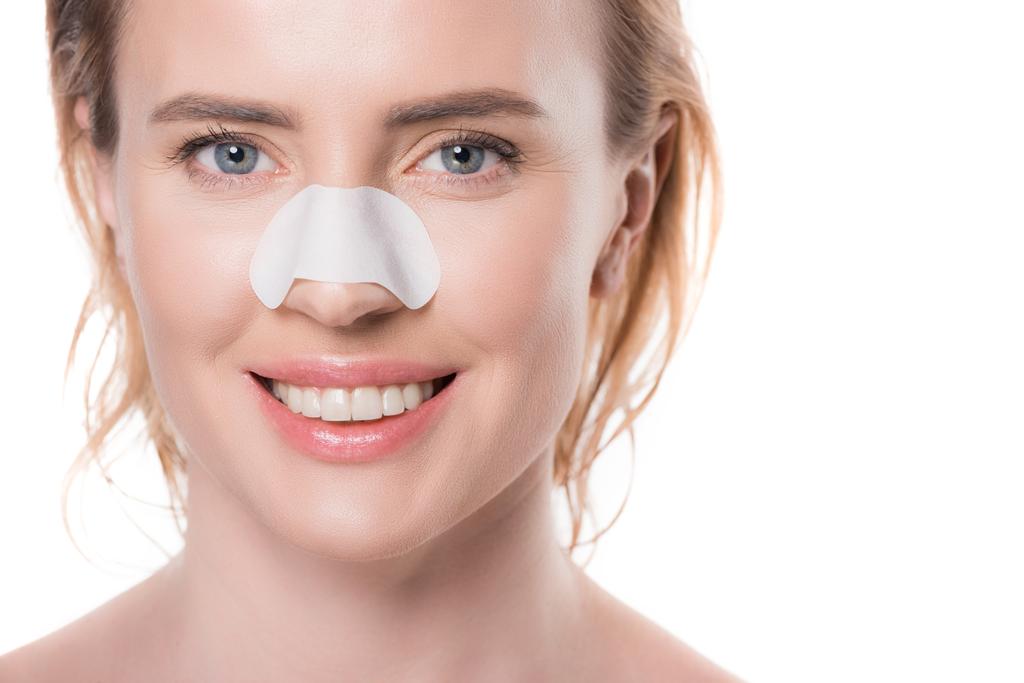 Žena s pruhem nos izolované na bílém - Fotografie, Obrázek