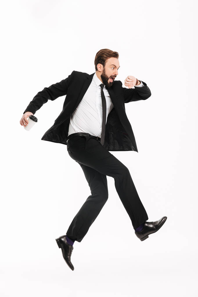 Scared young businessman running isolated - Photo, Image