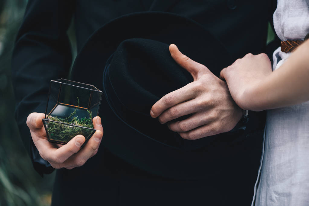 cropped shot of young couple standing together and man holding jewelry box with engagement ring - Photo, Image