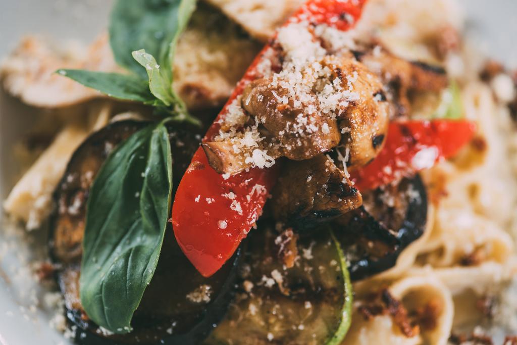 delicious vegetarian pasta with grilled vegetables and parmesan cheese   - Photo, Image