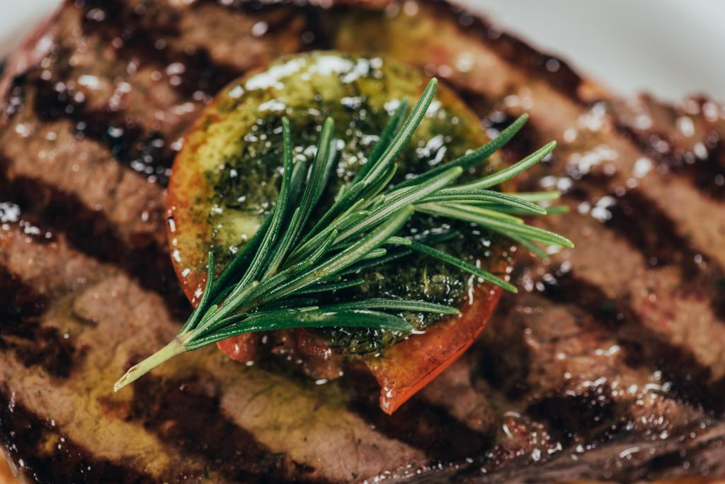 close-up view of delicious roasted juicy beef steak with rosemary - Photo, Image
