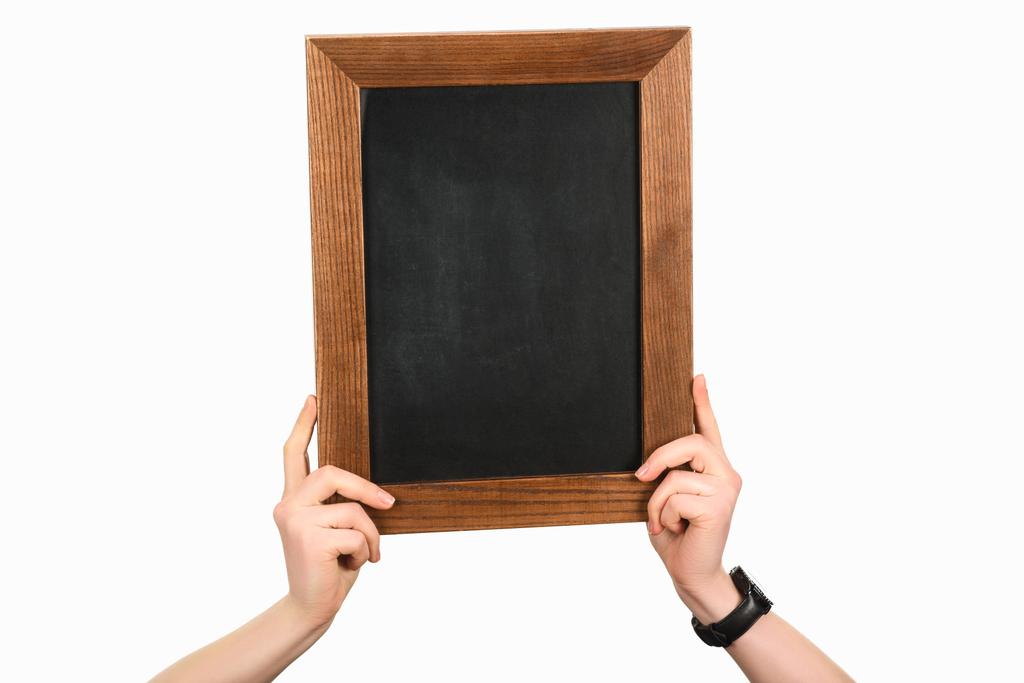 Cropped view of woman hands holding empty blackboard isolated on white - Photo, Image