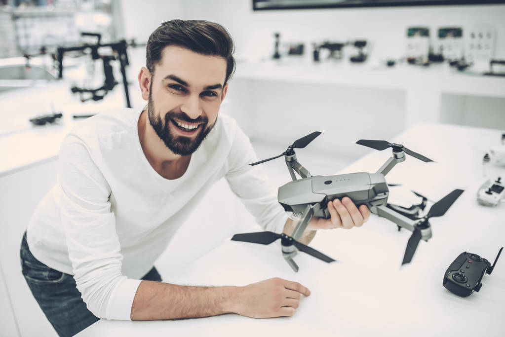 Man in quadcopter store - Photo, Image