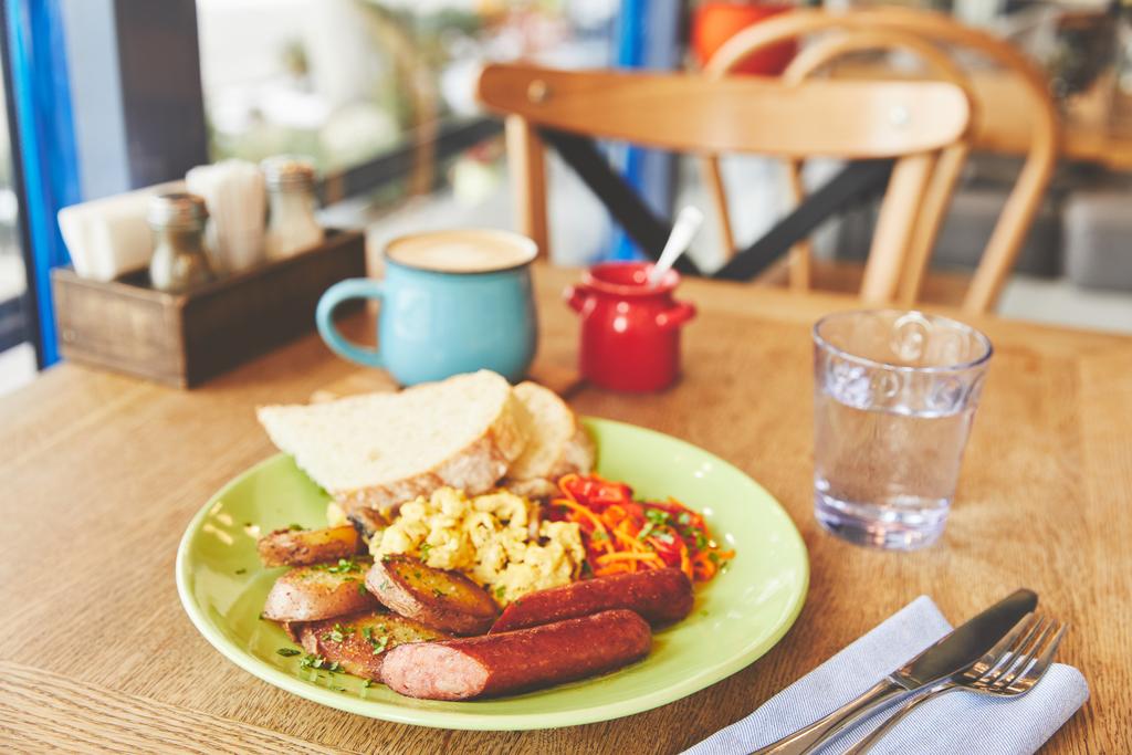 Brunch in restaurant with scramble eggs and coffee - Photo, Image