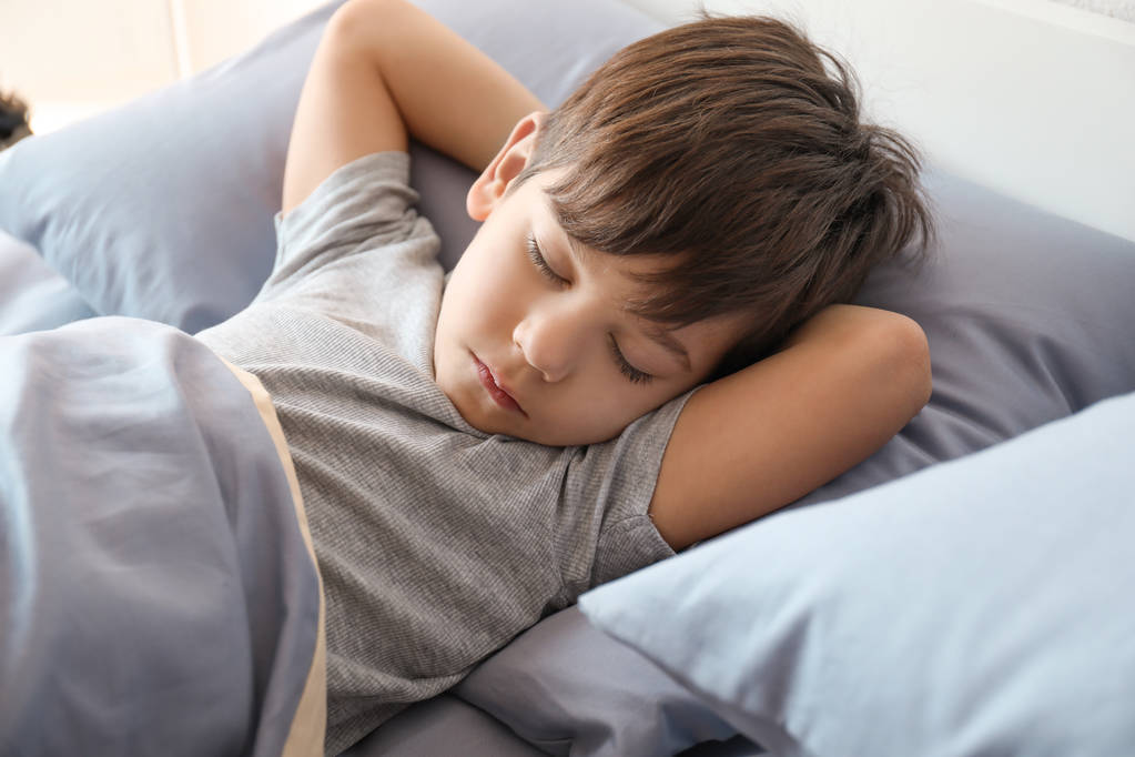Cute little boy sleeping in bed at home - Photo, Image