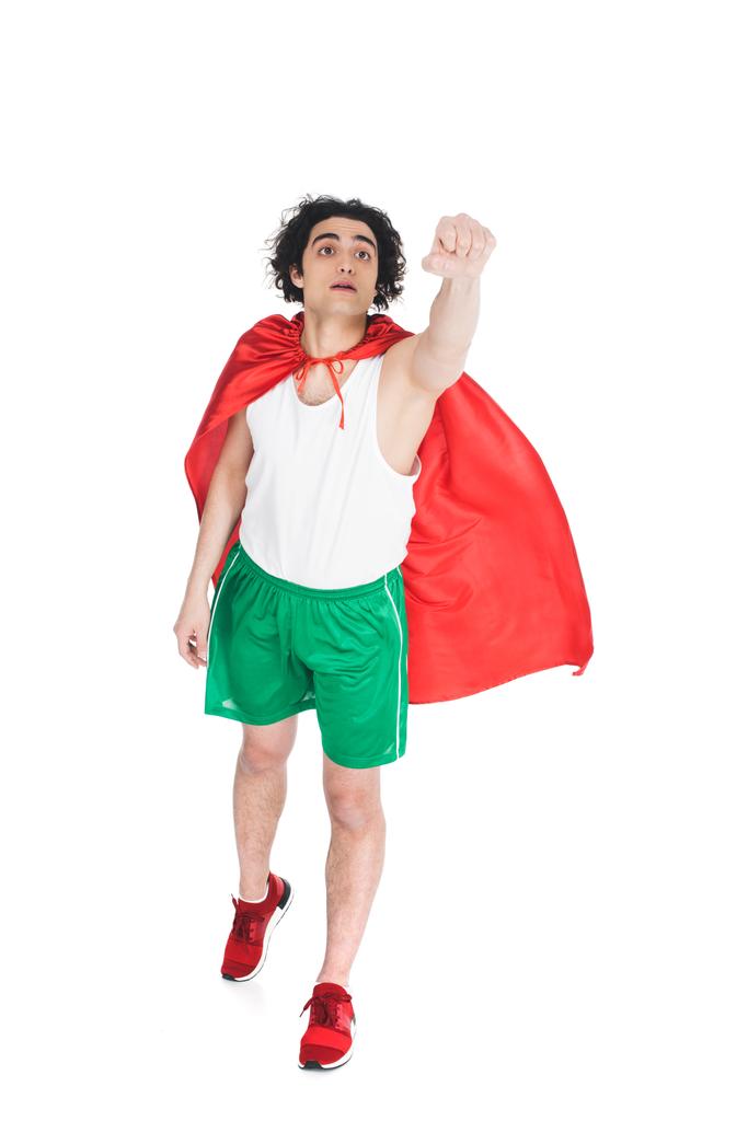 Jovem super-herói de capa vermelha retratando voar isolado no branco
 - Foto, Imagem