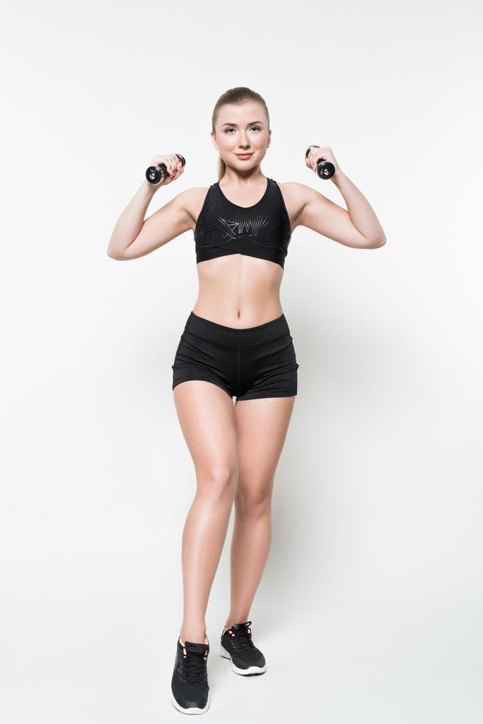 Sportos nő a súlyzó elszigetelt fehér képzés - Fotó, kép