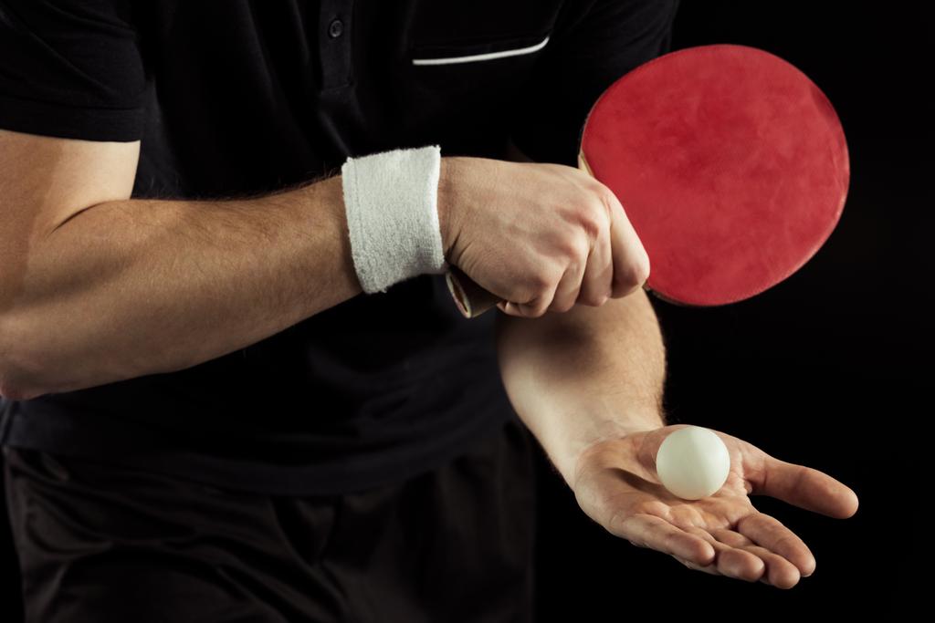 kırpılan tenisçi tenis top ve raket siyah izole elinde kadeh - Fotoğraf, Görsel