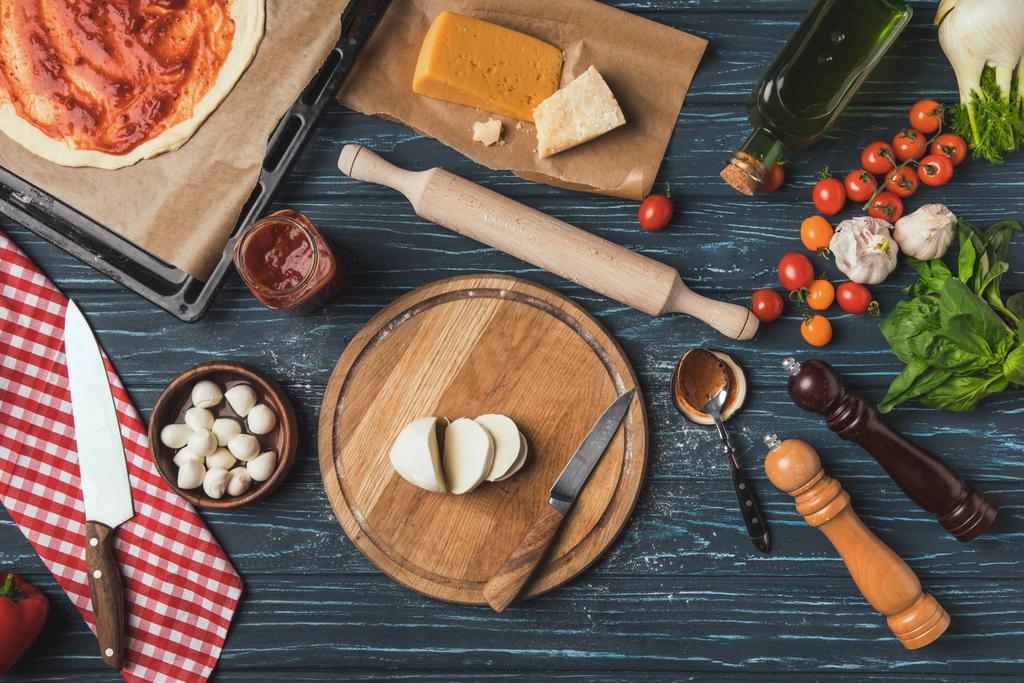 top view of ingredients for homemade pizza on kitchen table - Photo, Image