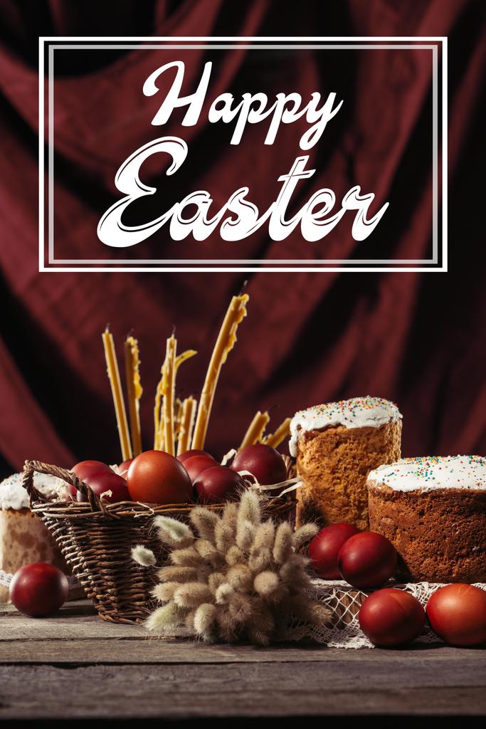 Gelukkig Pasen inscriptie in frame, Pasen, taarten, geschilderde kippeneieren en kaarsjes op tafel - Foto, afbeelding
