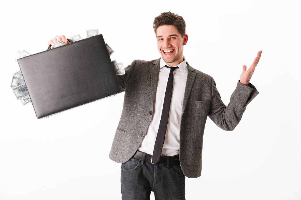 Portrait of a happy young businessman showing - Photo, Image