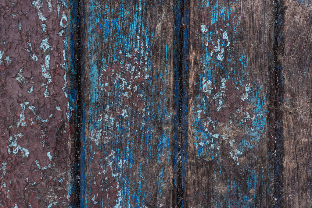 Old paint cracks on wooden surface background - Photo, Image