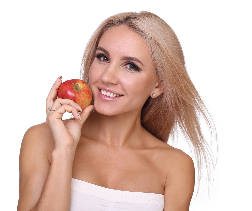 donna bionda mangiare mela rossa
 - Foto, immagini