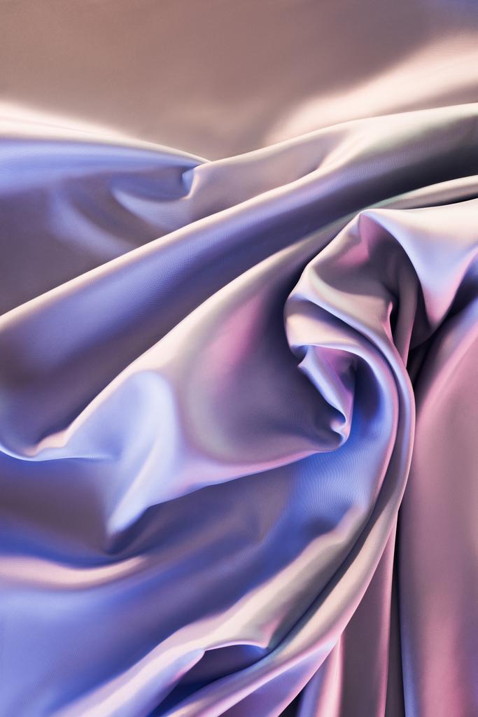 бежевый и фиолетовый блестящий шелковый фон
 - Фото, изображение