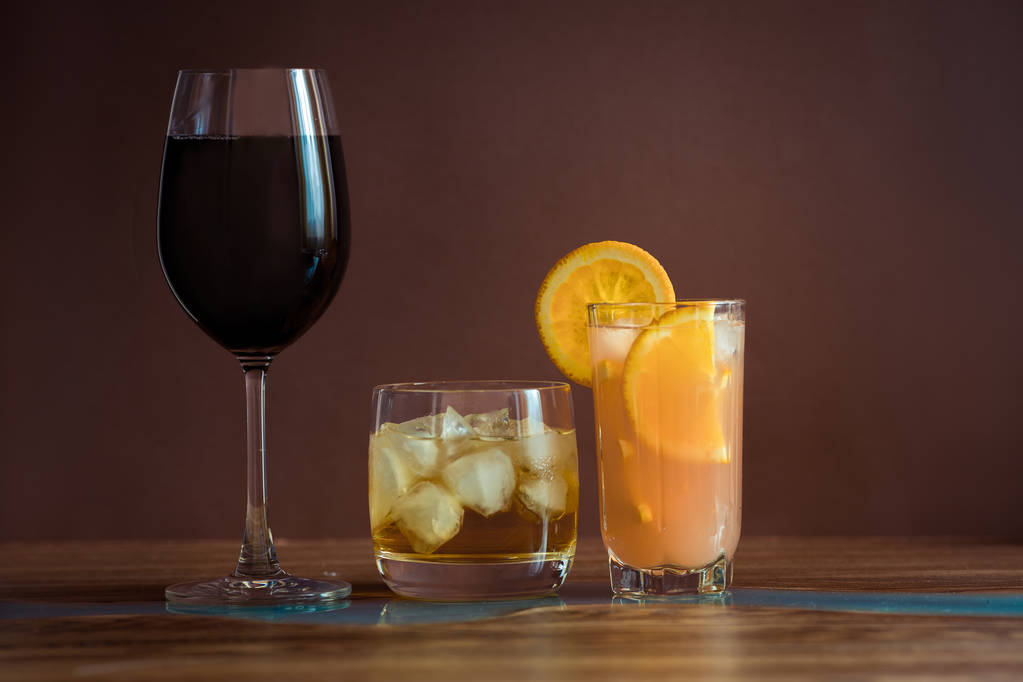 Alcohol drinks on dark solid background  - Photo, Image