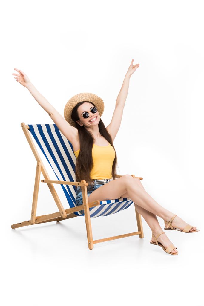 excited beautiful girl resting on beach chair, isolated on white - Photo, Image