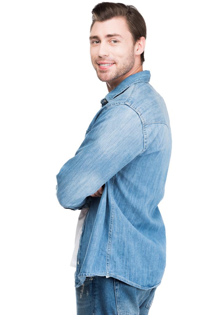Молодой человек в джинсе улыбается в камеру, изолированный на белом
 - Фото, изображение