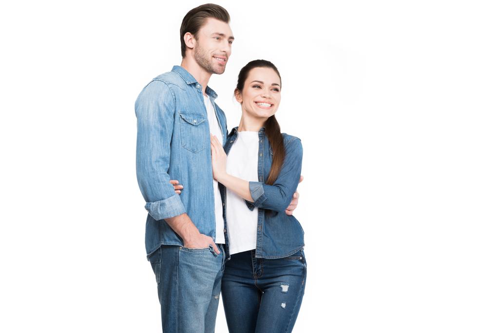Młoda para w dżinsy ogarnięcie na białym tle - Zdjęcie, obraz