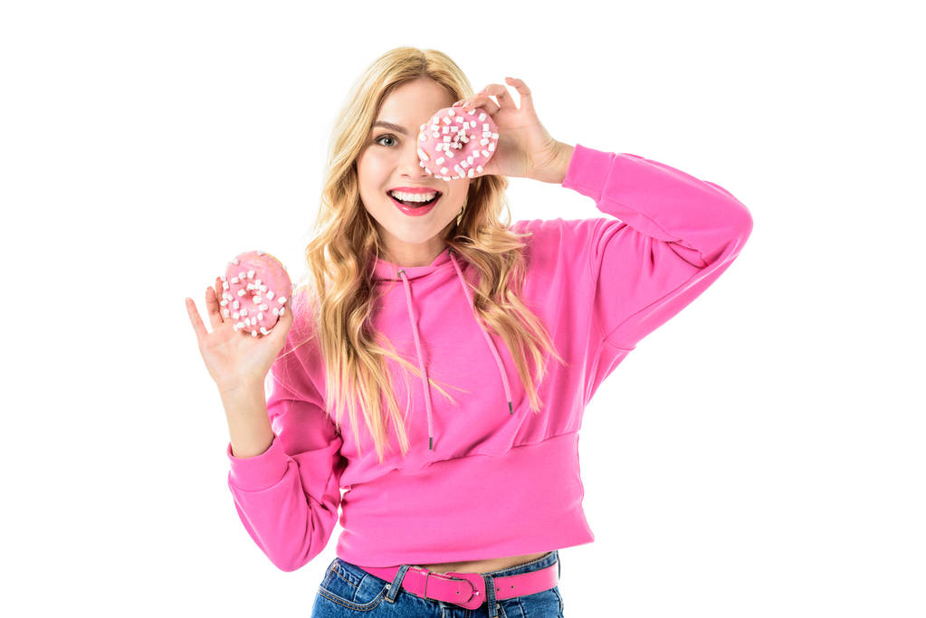 Jong meisje dragen van roze bedrijf donuts geïsoleerd op wit - Foto, afbeelding
