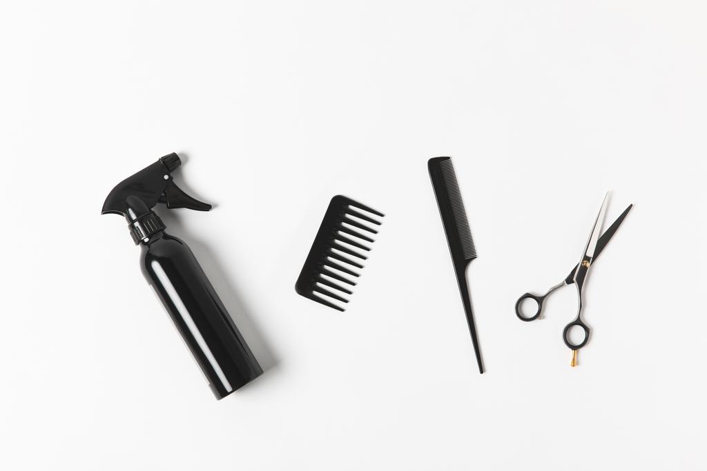 top view of spray bottle, combs and scissors, on white - Photo, Image