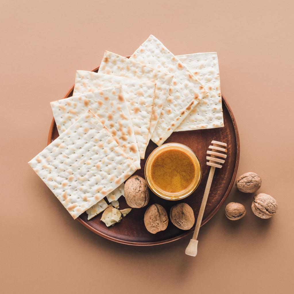 top view of matza with honey on tray, Passover Haggadah concept - Photo, Image