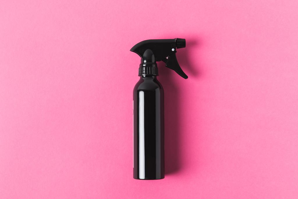 top view of black spray bottle, isolated on pink - Photo, Image