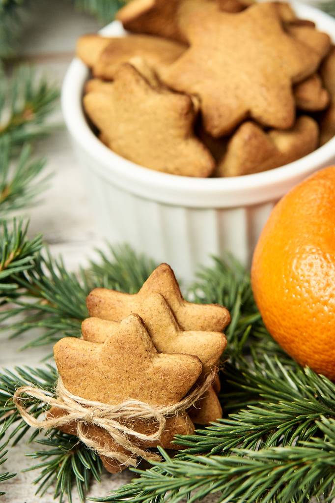 Gingerbread Cookie. Small stars. Delicious tangerine. NewYear. Fir branch - Photo, Image