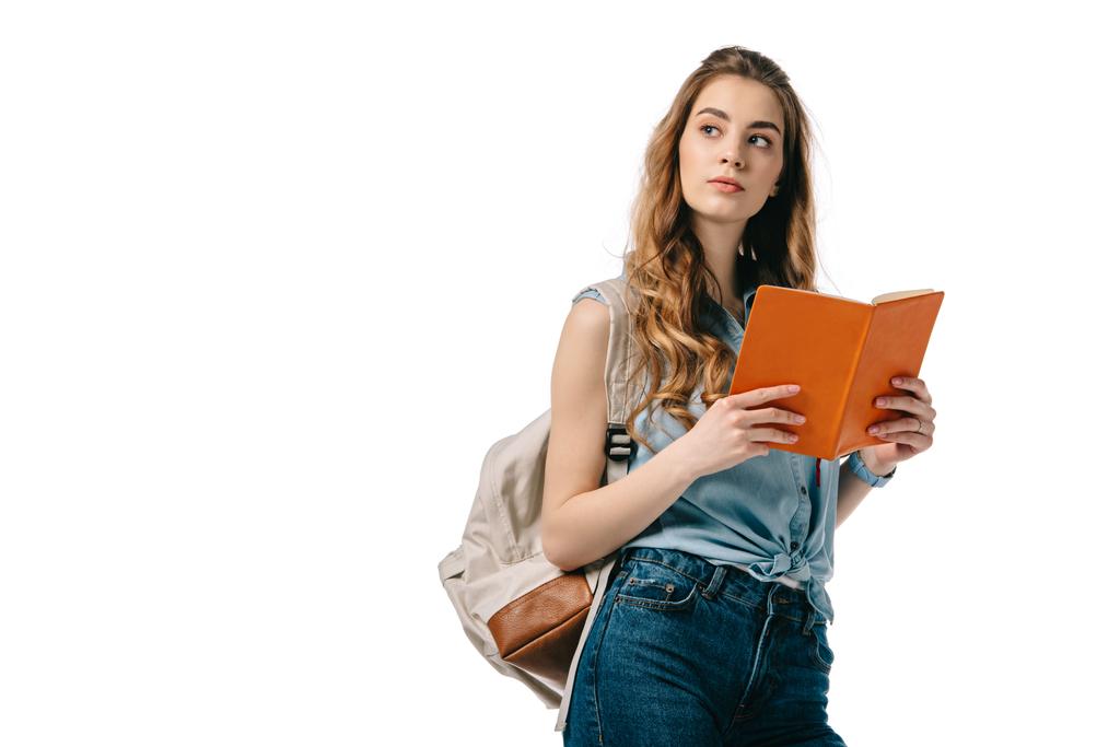 beautiful student holding open book and looking away isolated on white - Photo, Image