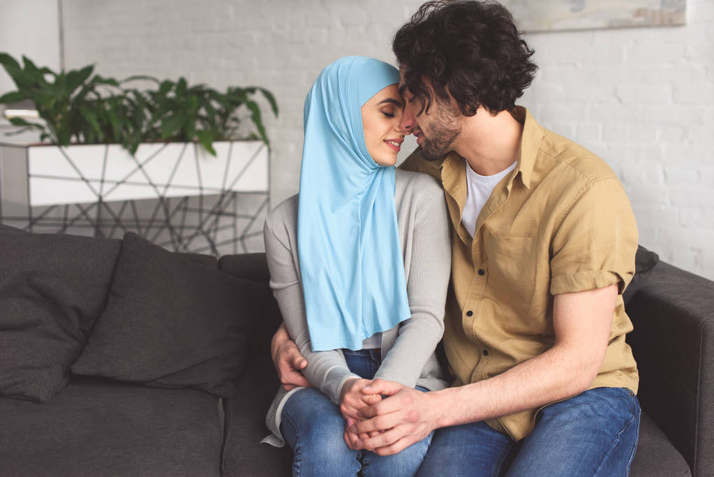 tender muslim couple hugging at home - Photo, Image