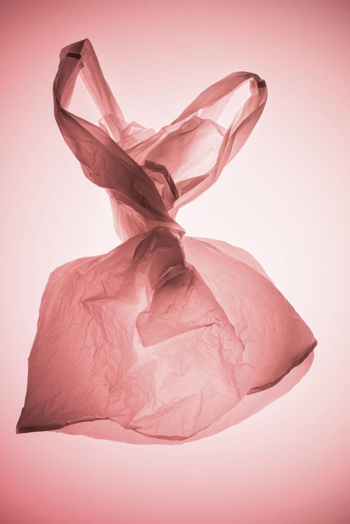 sac en plastique teid sous lumière rose pastel
 - Photo, image