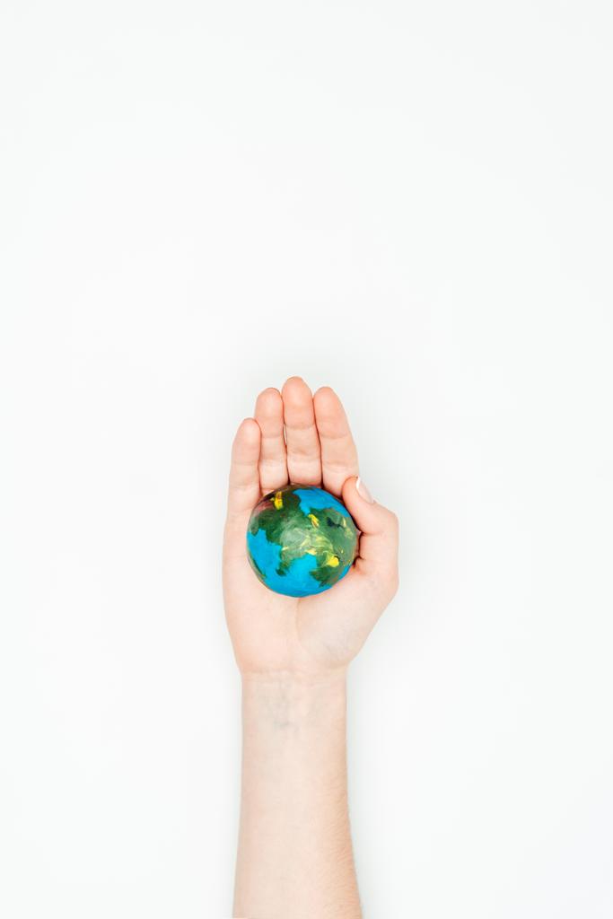 cropped image of woman holding earth model on hand isolated on white, earth day concept - Photo, Image