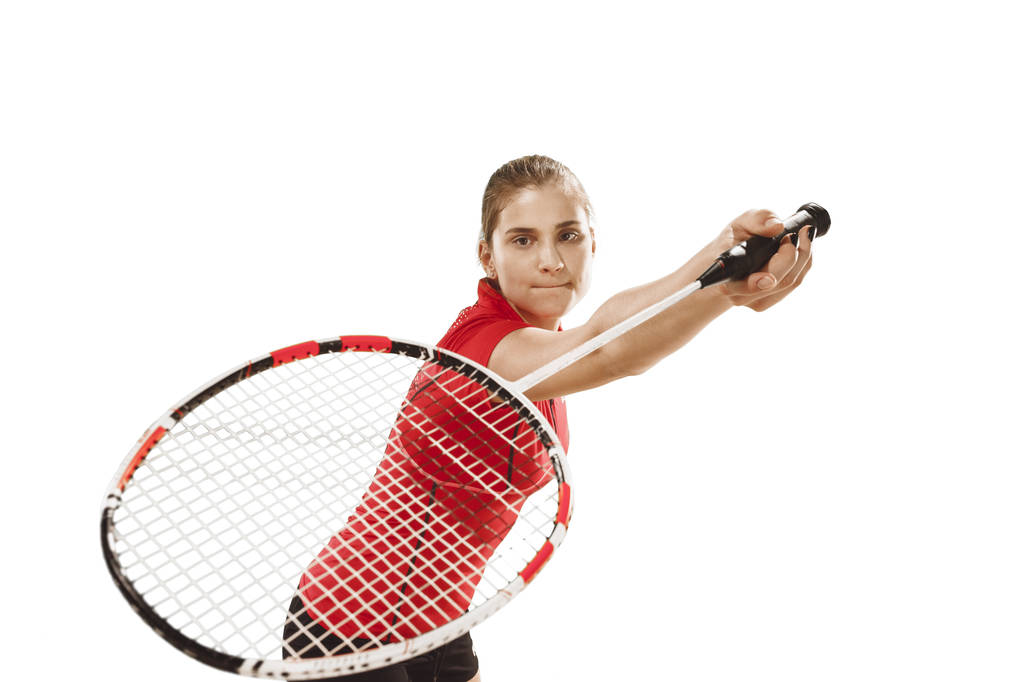 Jovem mulher jogando badminton sobre fundo branco
 - Foto, Imagem