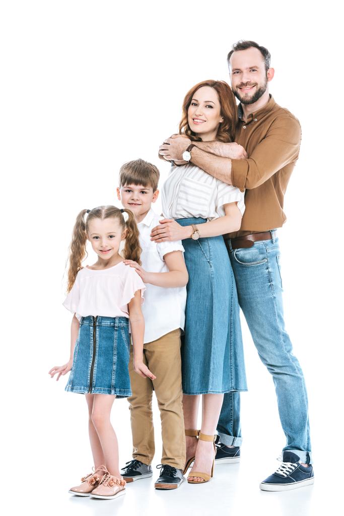full length view of happy family with two children standing together and smiling at camera isolated on white - Photo, Image