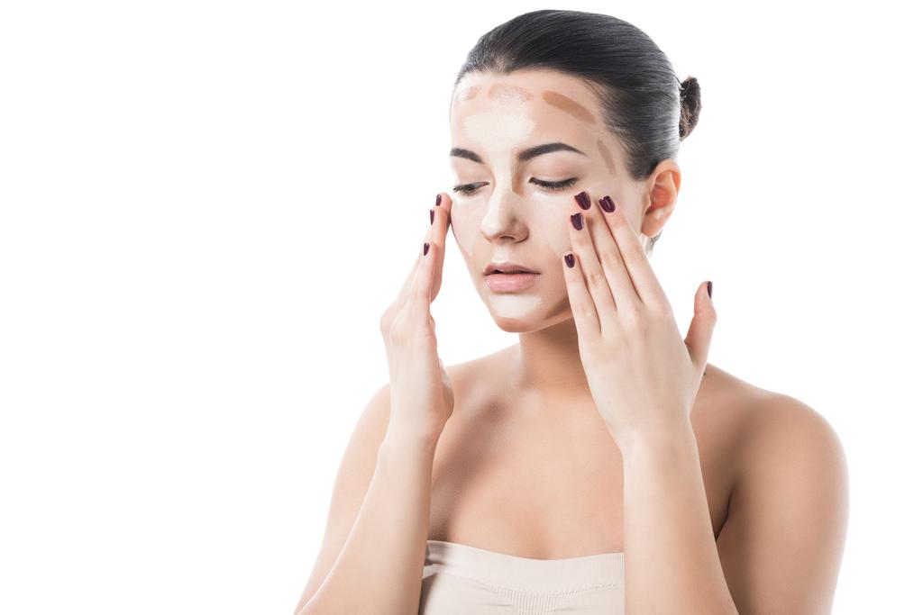 beautiful girl applying foundation cream on face isolated on white - Photo, Image