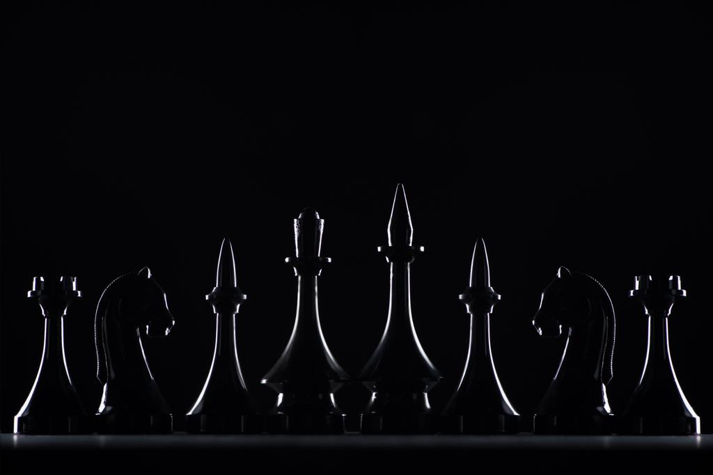 silhouettes of chess figures isolated on black, business concept - Photo, Image