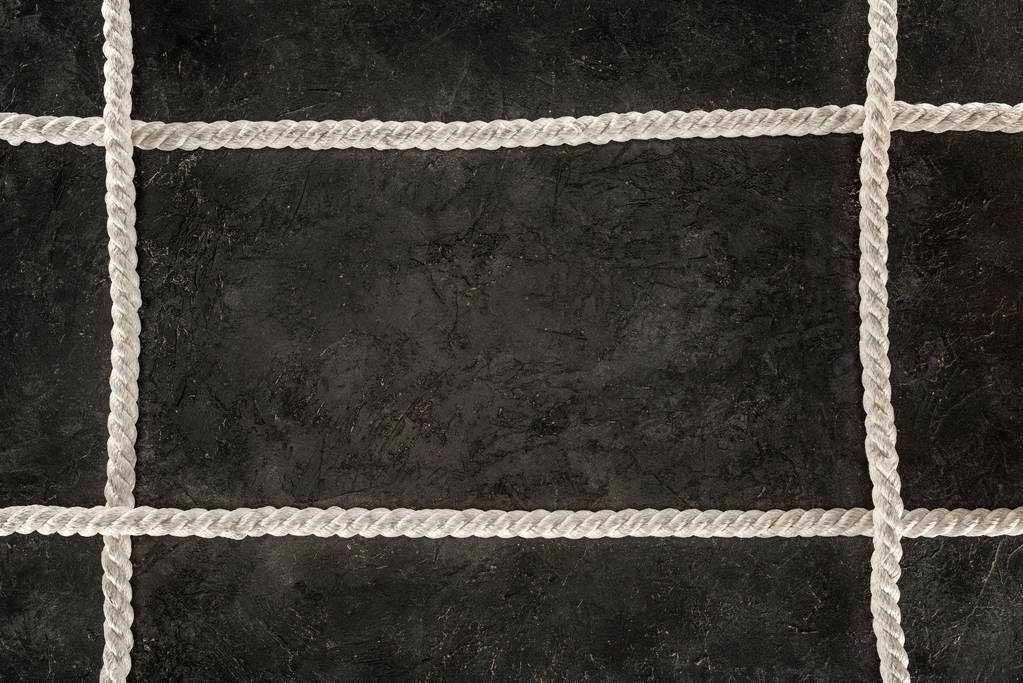 top view of arranged white marine ropes on dark concrete tabletop - Photo, Image