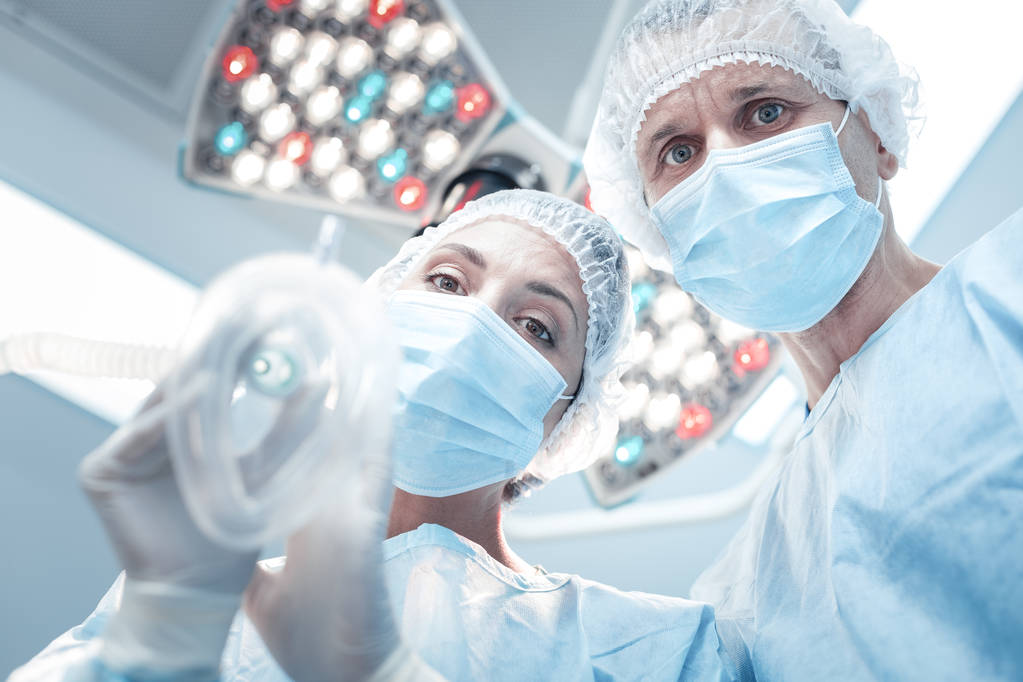 Professional skilled surgeons doing anaesthesia - Photo, Image