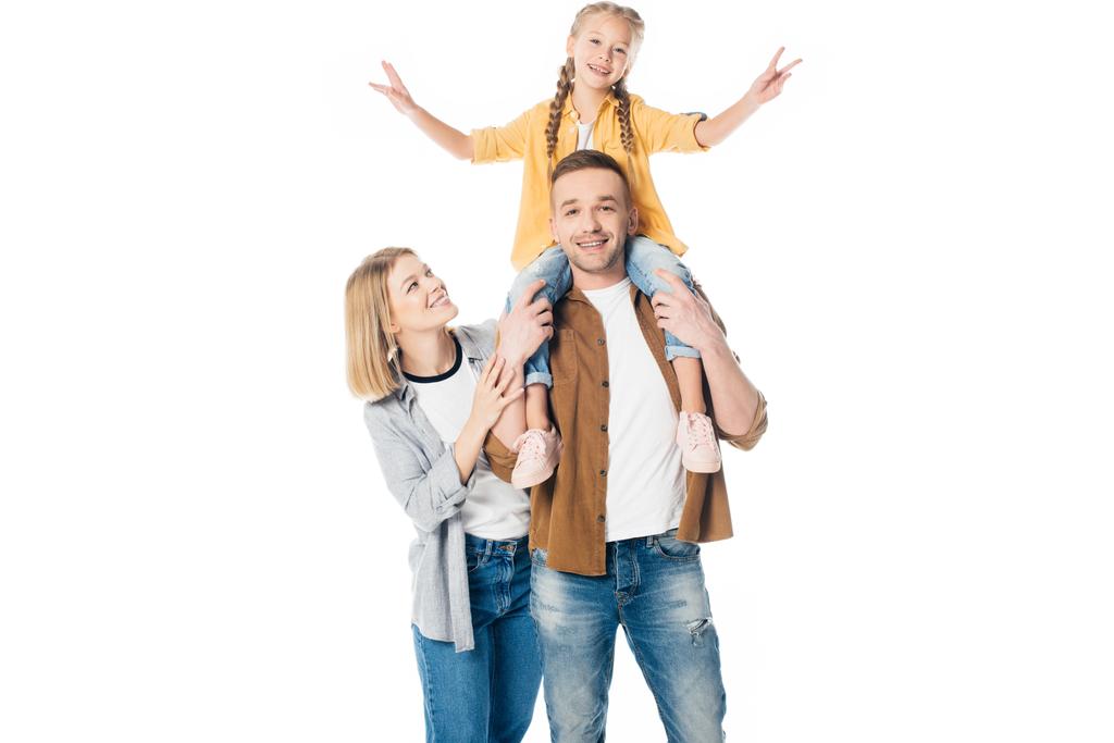 smiling father and daughter piggybacking with mother standing near by isolated on white - Photo, Image