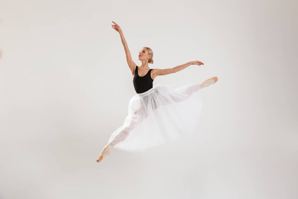Beautiful young woman ballerina dancing - Photo, Image