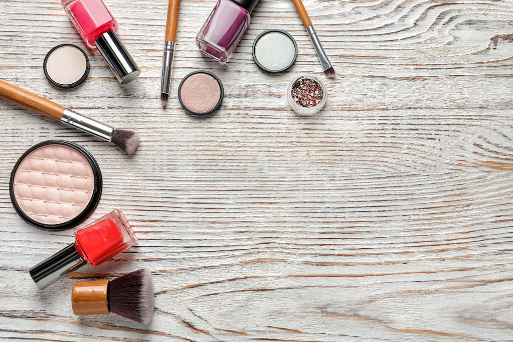 Flat lay composition with decorative cosmetics on wooden background - Photo, Image