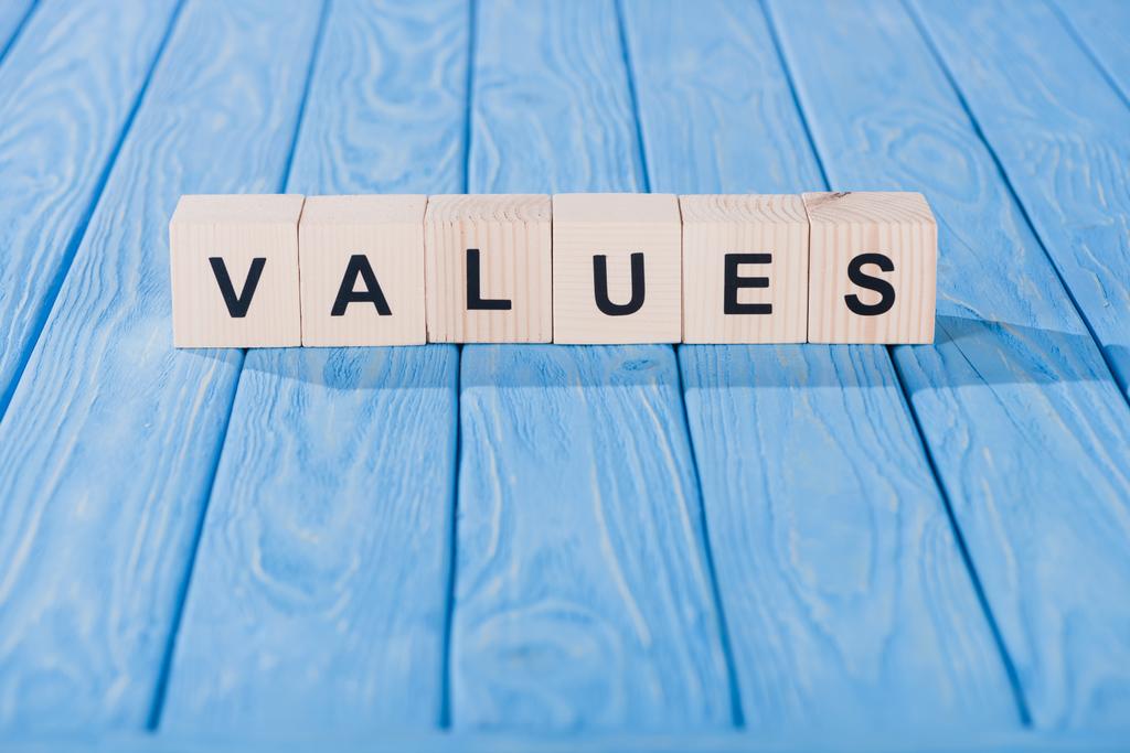 close up view of values word made of wooden blocks on blue tabletop - Photo, Image
